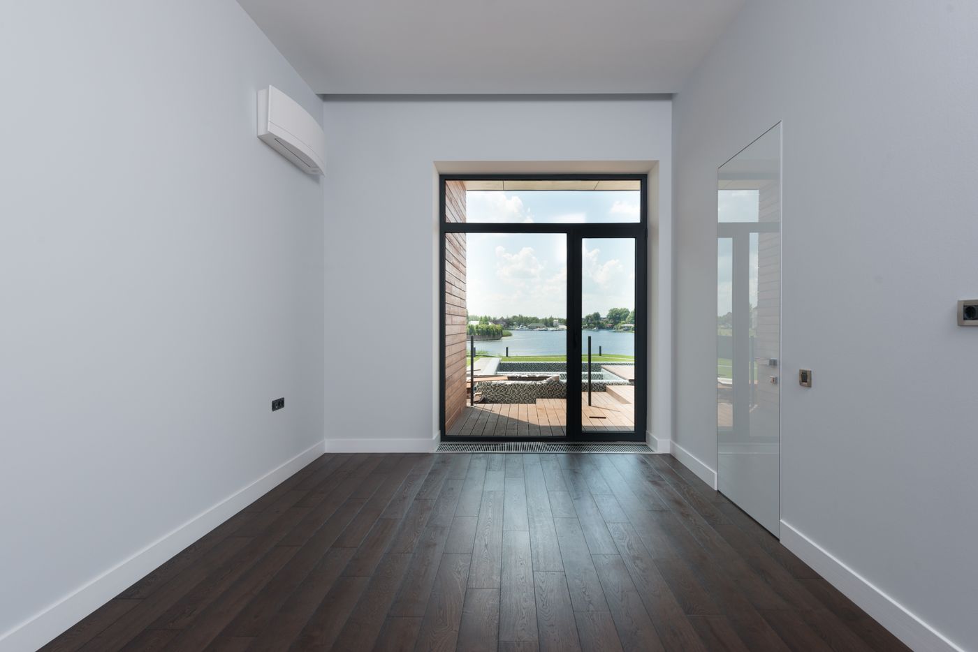 Bright contemporary room with dark framed glazing